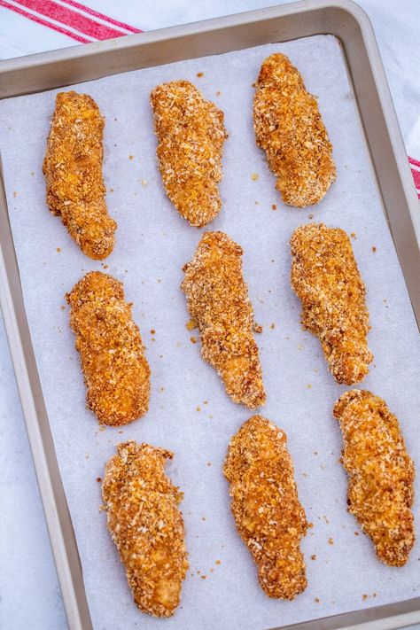 Crispy Oven Baked Chicken Tenders have a crunchy layer of crumbs on the outside and a juicy and tender on the inside! They are also simple and easy to prepare! #chicken #chickentenders #chickenrecipes #sweetandsavorymeals #recipesforkids Simple Chicken Strip Recipes, Easy Oven Fried Chicken Tenders, Breaded Chicken Tenders Fried, Oven Fried Chicken Tenders Crispy, Homemade Chicken Tenders Baked, Baked Chicken Tenders Recipes Oven, Chicken Tenders In Oven, Chicken Strips Baked, Easy Chicken Tender Recipes