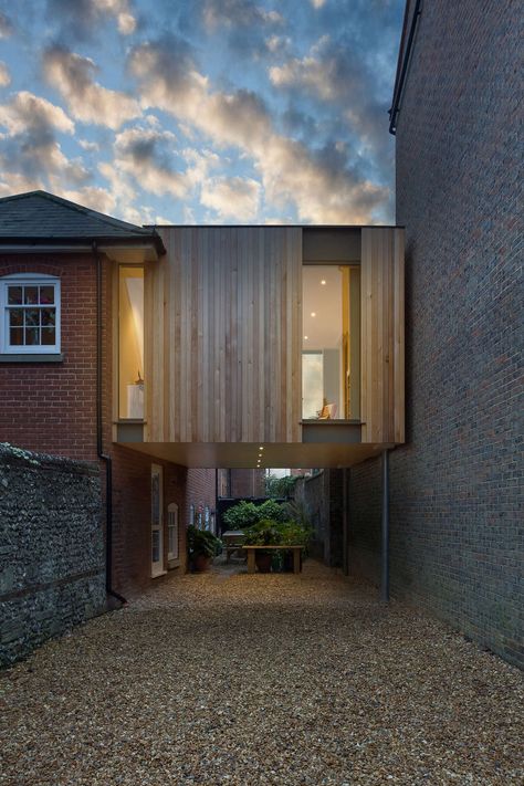 The brief was to replace an existing garage with a pair of semi-detached contemporary timber & zinc clad houses in Winchester, Hampshire which would accommod... Wooden Cladding, Building A Porch, Modern Extension, Timber Cladding, London House, Brick Facade, House With Porch, Timber House, House Extensions