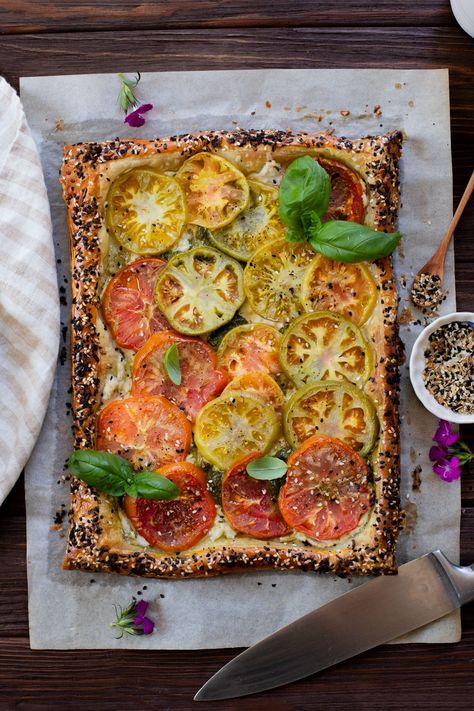 This vegan Heirloom Tomato Tart is made with puff pastry, a creamy non-dairy cheese, pesto & heirloom tomato slices. The perfect summer appetizer or brunch idea | ThisSavoryVegan.com #puffpastryideas #heirloomtomatorecipes #summerrecipes Heirloom Tomato Tart, Vegan Appetizers Recipes, Vegan Summer Recipes, Ricotta Recipes, Tomato Tart, Vegan Pesto, Savory Tart, Heirloom Tomato, Summer Appetizer