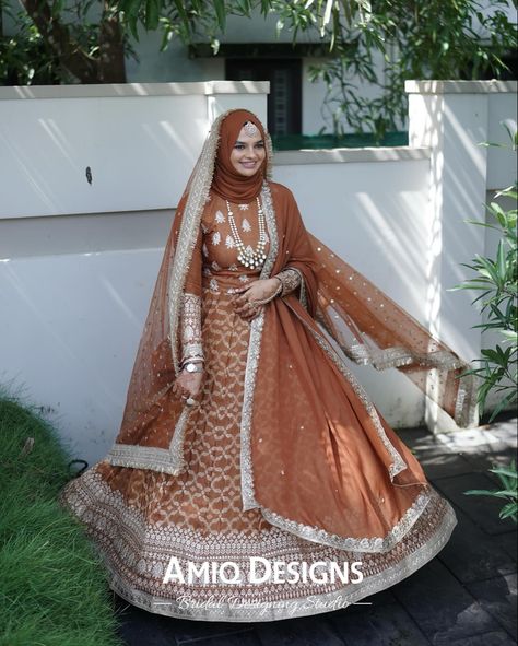 “This bridal lehenga in a soothing pastel brown shade is beautifully crafted with Banarasi material and delicate jerry thread borders, creating a timeless and elegant look. It comes with two matching dhupattas and a handworked blouse, and can be customized to suit your unique style preferences.” Banarasi Material, Pastel Brown, Bridal Lehengas, Brown Shade, Brown Shades, Bridal Lehenga, Suits You, Lehenga, Borders