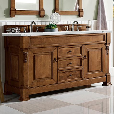 Bathroom Vanity Description The Brookfield 60" double sink in country oak vanity by James Martin Vanities features hand carved accenting filigrees and raised panel doors. Two doors, on either side, open to shelves for storage below and three center drawers, made up of a lower double-height drawer and both middle and top standard drawers, offer additional storage space. The look is completed with antique brass finish door and drawer pulls. Matching decorative wood backsplash is included. Bathroom Bathroom Vanity Double Sink, Antique Bathroom Vanity, Oak Bathroom Vanity, Shelves For Storage, Wood Backsplash, Raised Panel Doors, James Martin, Double Vanity Bathroom, Double Sink Vanity