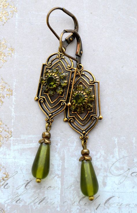 VINTAGE ELEMENTS Unique Jewellery, Handmade from Vintage Inspired Original Designs Art Nouveau, Art Deco, Edwardian, Victorian style Earrings with  Olivine Green Crystals and Frosted Glass Teardrop. These earrings are made with antiqued brass  leverback earwires and measure 6.2cm from the top of the earwires. Gaudy Jewelry Vintage, Art Deco Inspired Outfit, Filigree Jewelry Vintage, Vintage Green Earrings, Green Teardrop Earrings, Vintage Green Jewelry, Art Neauveau Fashion, Victorian Gold Jewelry, Art Nouveau Clothing