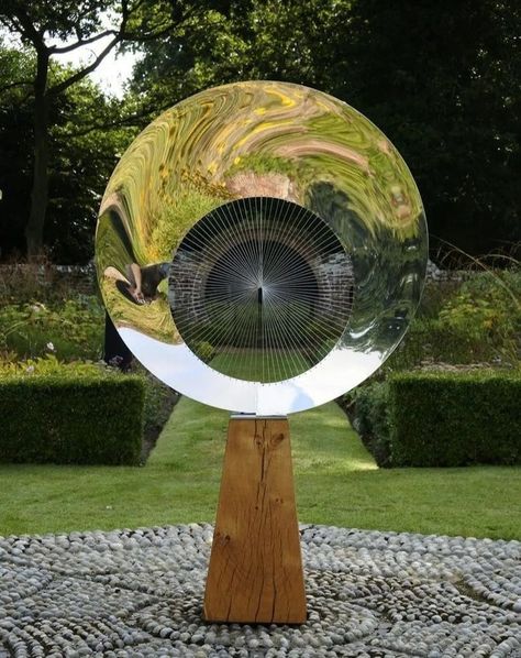 "Halo" by @thomasjoynessculpture is an elegant work of art crafted from mirror-polished stainless steel, giving it a reflective and gleaming surface that interacts with its surroundings. The circular form of the sculpture evokes a sense of balance and infinity, its smooth and flowing design symbolising unity and harmony. The reflective quality of the stainless steel creates dynamic visual effects, allowing the piece to change with the light and environment around it. It is complimented by a b... Stainless Steel Sculpture, Beautiful Sculptures, Portland Stone, Yard Sculptures, Wind Sculptures, Metal Sculptures, Bottle Garden, Pottery Handbuilding, Public Sculpture