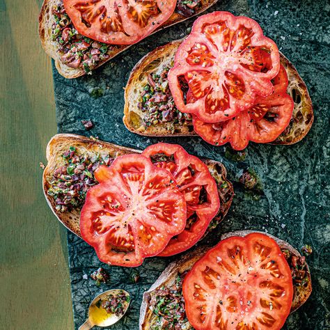 Beefsteak Tomatoes with Black Olive and Orange Tapenade Recipe | Recipes from Ocado Tapenade Recipe, Tomatoes On Toast, Beefsteak Tomato, Olive Tapenade, Pickle Relish, On Toast, Sliced Tomato, Tapenade, Meal Deal