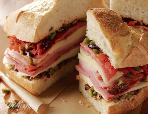 One of our most favorite Cajun-inspired dishes (for Mardi Gras or anytime) is the mountain of a sandwich called the muffaleta which includes a variety of deli meats and cheeses. Cold Cut, Meat Appetizers, Deli Meats, Starting Line, Sandwiches For Lunch, Burgers Sandwiches, 100 Years Ago, Southern Cooking, Deli Meat