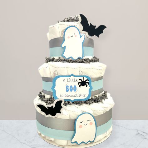 Diaper Cake Halloween Theme, Halloween Themed Diaper Cake, Halloween Diaper Cake Ideas, Ghost Baby Shower Ideas, Baby Shower October, Halloween Baby Shower Cake, Halloween Diaper Cake, Halloween Shower Ideas, Dipper Cakes