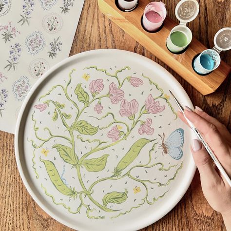 Ready to bake! @clay_and_coffee 🎨✍🏼 #ceramicpainting #sweetpea #butterfly #flowers #art #botanicals #southafrica Creative Pottery Painting Ideas, Butterfly Ceramic Painting, Flowers Pottery Painting, Cute Pottery Painting Ideas Plates, Painting Plates Ideas, Plate Painting Ideas Diy, Flower Pottery Painting, Pottery Painting Flowers, Painted Plates Ideas