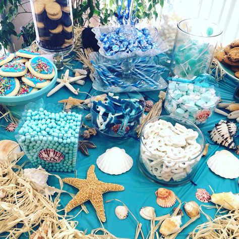 Beach themed party table with seashells and ocean blues Beach Theme Party Decorations, Beach Birthday Party, Sea Baby Shower, Beach Party Decorations, Sea Birthday Party, Mermaid Theme Party, Mermaid Baby Showers, Beach Themed Party, Mermaid Parties