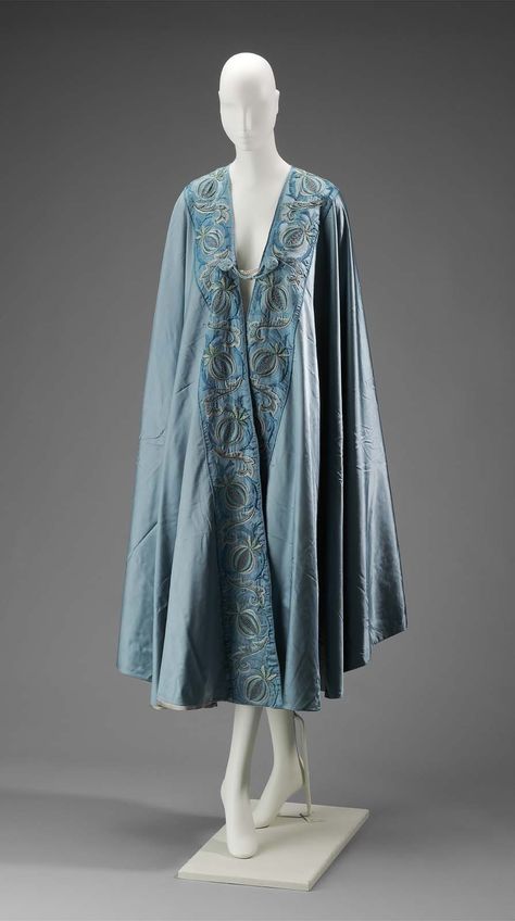 Early 20th century - Opera Coat - Teal opera coat with floral design embroidered at edges. Teal and green tassels at corners. Raven Cloak, Wizard Cloak, Blue Cloak, Teal And Green, Opera Coat, 20th Century Fashion, Coat Vintage, Historical Dresses, Fantasy Clothing