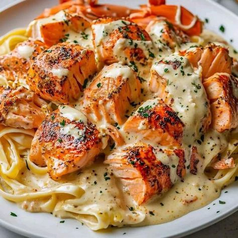 Slow Cooker Kitchen | Cajun Lobster and Salmon Alfredo | Facebook Salmon Alfredo, Slow Cooker Kitchen, Pasta Seasoning, Salsa Fresca, Lobster Tail, Fettuccine Pasta, Lobster Tails, Seafood Pasta, Salmon Fillets