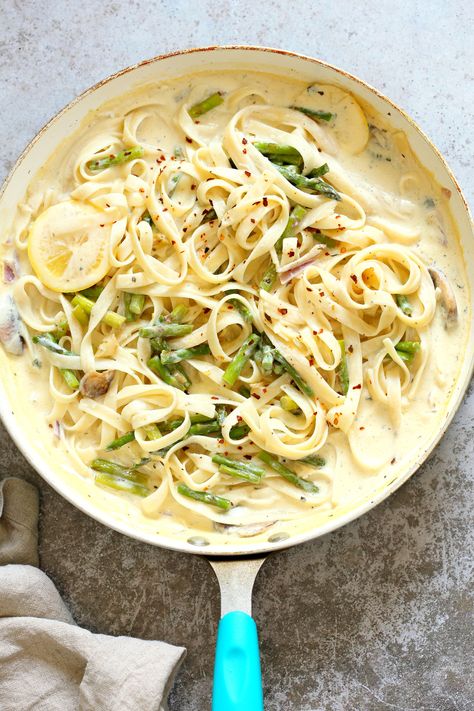 Vegan Lemon Asparagus Pasta - 30 mins! Creamy Lemon Alfredo style sauce with tofu with fettuccine and pan roasted garlic asparagus and more lemon. #Vegan #Nutfree #Recipe. Can be Glutenfree #VeganRicha #LemonAsparagusPasta 17 gm of protein Tofu Cream Sauce, Vegan Asparagus Recipes, Lemon Vegan, Lemon Asparagus Pasta, Garlic Asparagus, Lemon Cream Sauces, Lemon Asparagus, Vegan Richa, Asparagus Recipes