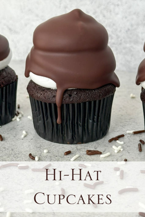 Hi-Hat Cupcakes: Dark chocolate cupcakes filled with a semi-sweet chocolate ganache, topped with soft, cloud-like marshmallow meringue and dipped in a dark chocolate shell.

These cupcakes are undoubtedly much more delicious than they look (and they look stunning!) High Hat Cupcakes, Hi Hat Cupcakes, Hard Shell Chocolate, Chocolate Dipped Cupcakes, Marshmallow Meringue, Hat Cupcakes, Chocolate Cupcakes Filled, Dark Chocolate Cupcakes, Chocolate Dipped Marshmallows