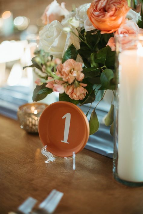 Clay saucers used as table numbers Pottery Table Numbers, Terra Cotta Pot Wedding Decor, Ceramic Table Numbers, Ceramic Centerpieces Wedding, Ceramic Wedding Table Numbers, Ceramic Table Numbers Wedding, Terracotta Pots Wedding, Terracotta Pot Seating Chart, Mexican Wedding Table Numbers