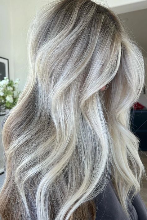 Woman with platinum balayage. Ash Blonde Balayage On Dark Hair Long, Ash Highlights On Blonde Hair, Icy Blonde With Root Melt, Honey Blonde And Platinum Highlights, Hair Color With Silver Highlights, Blonde With Brown Undertones, Bright Blonde Root Melt, Blonde With Dark Brown Roots, Blond Ash Balayage