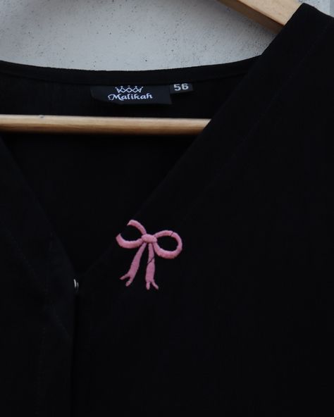 Introducing our Black Abaya with Pink Bow Embroidery! 🎀✨ This abaya effortlessly combines timeless elegance with a touch of modern flair. Made from luxurious black fabric, it’s elevated by the adorable pink bow embroidery. 🌸 Perfect for both casual outings and special occasions, this trendy piece is designed to stand out while keeping you comfortable. Meticulously crafted to ensure quality and style in every stitch. Step up your modest fashion game with Malikah. 💫 #malikahmodestwear #bowa... Bow Embroidery, Black Abaya, Pink Bow, Touch Of Modern, Black Fabric, Modest Fashion, Step Up, Fashion Games, Timeless Elegance