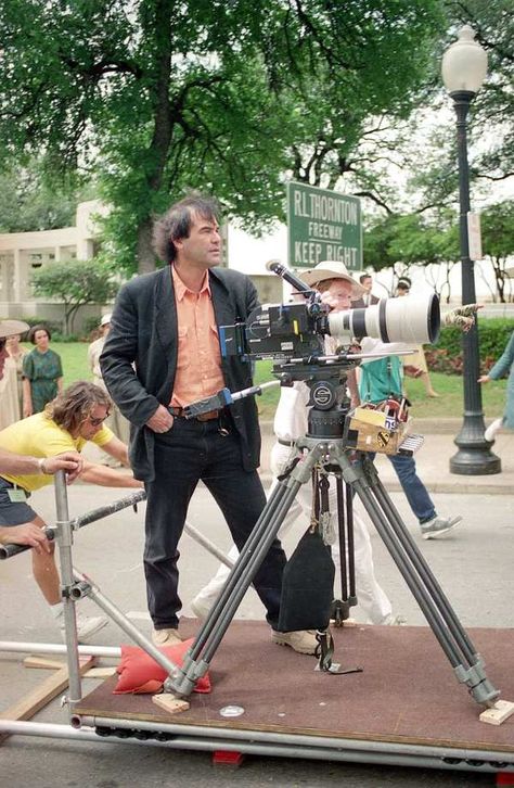 Oliver Stone gets a look at a camera angle for a motorcade scene in his film JFK in Dallas, Texas, on April 17, 1991. Roger Rabbit Characters, Charles Fleischer, Robert Richardson, Oliver Stone, Fritz Lang, Kevin Costner, Film History, Martin Scorsese, Stanley Kubrick