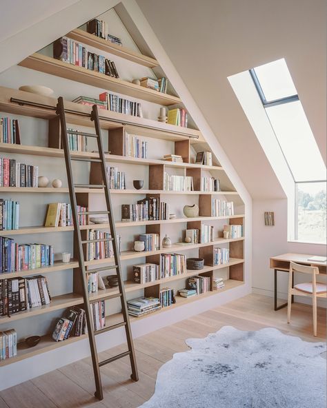 Introducing the statement bookcase from our recent House in Surrey project📚 Custom joinery transforms this attic nook into a bibliophile’s dream, perfectly fitted under the vaulted ceiling. It’s the ultimate cosy reading corner that combines practicality with a love for design! Handcrafted by @endgrainltd . . . . #bookcase #custombookcase #bespokebookcase #joiners #joinery #carpenters #carpentry #highendjoinery #bespokejoinery #joineryworkshop #joinerydesign #custommade #woodworking #wea... Loft With Bookshelves, Double Height Bookshelf, Built In Bookshelf With Ladder, Builtin Bookshelves Vaulted Ceiling, In Home Library With Ladder, Vaulted Ceiling Shelving, Vaulted Ceiling Bookshelf, Floor To Ceiling Bookcases Built Ins, Bookcase Vaulted Ceiling