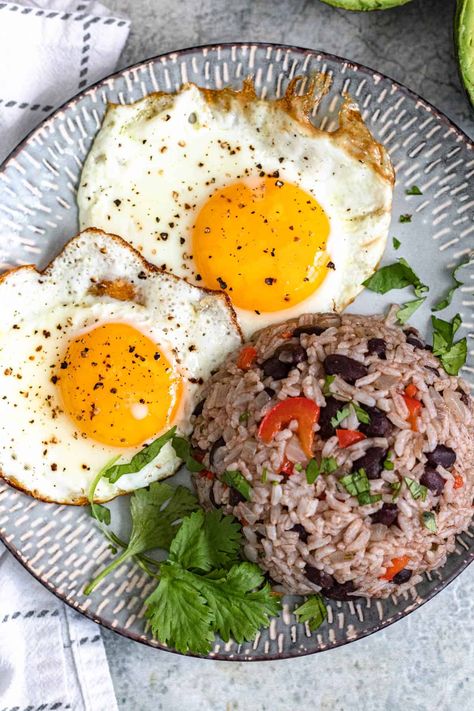 Gallo Pinto is a flavorful but simple rice and bean dish traditionally served in Costa Rica alongside eggs, tortillas, and strong coffee at breakfast time. It’s a great way to use up leftover beans and rice and the unique flavors could be enjoyed any time of day! Rice And Beans Breakfast, Eggs And Tortillas, Gallo Pinto Recipe, Gallo Pinto, Rice And Beans Recipe, South American Recipes, Dried Black Beans, Easy Rice Recipes, American Recipes