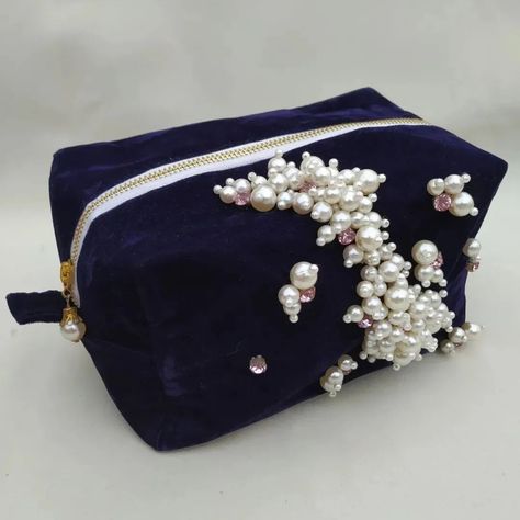 Handmade bridal makeup pouch #bridalbag #bag #cosmeticpouch #velvetmakeuppouch #makeup #bridalmakeupbag #pinkvelvetbag #shabanaatelier #bagtalkies #instafashion #boxybag #sewingproject #handmade #smallbusinessowner #supportsmallbusiness #reels #uniquebags #designer #designerbags #purse #highfashion #luxuryfashion #Handbagobsessed #handbagaddict #baggoals #luxurytravel #purselovers #purseaddict #bagsofinstagram #handbagscollection Luxury Pouch Bag With Pearl Handle, Luxury Pearl Embroidered Pouch Bag, Luxury Pearl-embroidered Pouch Evening Bag, Luxury Beaded Pouch Bag, Velvet Pouch Bag, Makeup Pouch, Bridal Makeup, Pouch, Purse