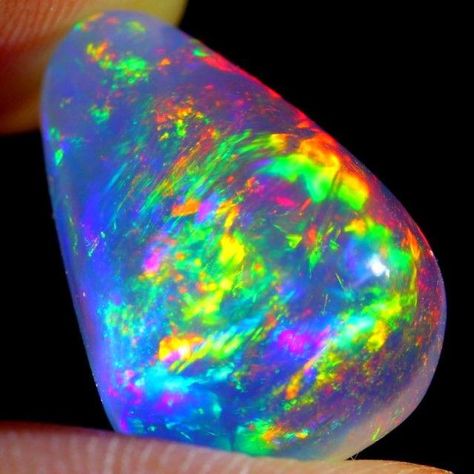 Discover the mesmerizing beauty of this Ethiopian non-hydrophane crystal opal. Originating from Welo, Ethiopia, this untreated gem is a true treasure. Get enchanted by its diffracted play of colors, creating a mesmerizing visual spectacle. Known as Contraluz opal, its name means 'against the light' in Spanish, perfectly capturing its otherworldly glow. Follow us for more captivating content on crystals and gems. Limited stock available. Don't miss out on this truly unique piece! Rocks And Fossils, Magic Stones, Rainbow Opal, Crystal Therapy, Crystal Opal, Beautiful Rocks, Rainbow Crystal, Minerals And Gemstones, Amethyst Quartz