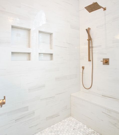 If there's a room that deserves a little luxury, it's the bathroom. Take a seat and enjoy a built-in shower bench. Longer showers just got better! #dreamhomedesign #customdesigns #interiorideas #interiordesignnc #bathroomremodel Two Shower Niches, Shower Bench Built In, Bathroom Seat, Spa Like Bathrooms, Gold Shower, Luxurious Showers, Shower Seat, Basement Makeover, Shower Niche