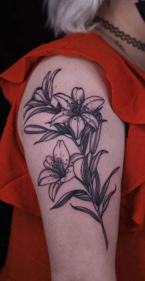 Blackwork Lily Tattoo, Single Lilly Tattoo, Tiger Lily Wrist Tattoo, American Traditional Lilly Tattoo, Traditional Style Lily Tattoo, Old School Lily Tattoo, Lilly’s Tattoo, Daylily Tattoo Movements, Lily Of The Incas Tattoo