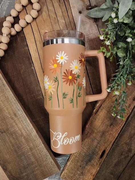 Get ready to elevate your sipping experience with this limited-edition collection!  Each 40oz tumbler with handle is a handpainted floral design that will make you stand out from the crowd.  Each cup is sanded, painted, and sealed with coats of matte spray.   "Bloom" is vinyl along bottom. This tumbler works great for Water Bottle Art, Markers Drawing Ideas, Eco Friendly Art, Vinyl Tumblers, Metal Tumblers, Painted Cups, Painting Glassware, Tumbler Cups Diy, Diy Cups