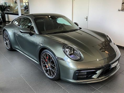 The Aventurine Green Metallic match perfectly with this brown interior 👌🏻 what a great specs on this 992 !  _ Join us 👉🏼 @porsche.universe… Narcos Wallpaper, Porsche 992, Good Looking Cars, Porsche Sports Car, New Sports Cars, Jaguar Xk, Porsche Cars, Dream Garage, German Cars