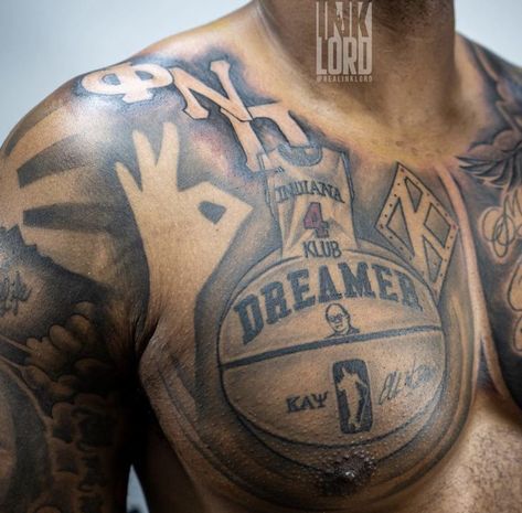 Basketball Shoulder Tattoos, Nupe Kappa Tattoo, Half Chest Tattoo Men Ideas Black Man, Chest Tattoo Black Men, Black Men Chest Tattoos, Basketball Tattoos For Men Ideas, Chest Tattoo Men Ideas Black Man, Kappa Tattoo, Half Chest Tattoo Men Ideas