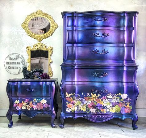 Spectacular luxury dresser and matching nightstand. The curvy body is unusual and a rare find. It has been painted in metallic hues of purple, blue, and pink. The colors swirl and meld together giving it an iridescent shine. Bright pressed flowers embellish the bottom of the chest of drawers and nightstand adding even more color. You won't lack storage with 6 wide and deep drawers for your clothing. The nightstand has 2 drawers. This mesmerizing set is sure to captivate any gaze. White-Glove shi Dresser Nightstand, Wood Chest Of Drawers, Whimsical Painted Furniture, Nightstand Set, Glass Dresser, Whimsical Furniture, Furniture Wood, Wood Chest, Painting Furniture Diy