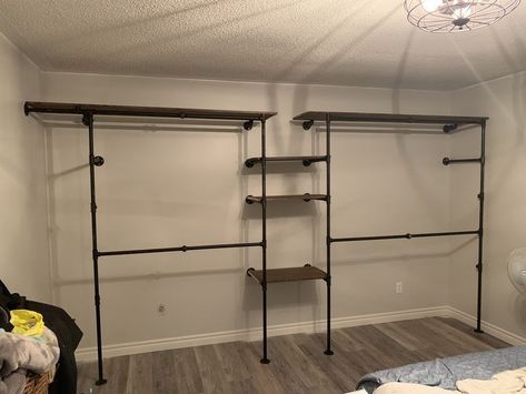 Industrial Pipe Closet Shelf, Closet Without A Closet, Industrial Farmhouse Closet, Industrial Pipe Closet Ideas, Black Pipe Closet Ideas, Basement Walk In Closet, Industrial Walk In Closet, Open Concept Closet In Bedroom, Homemade Closet Ideas