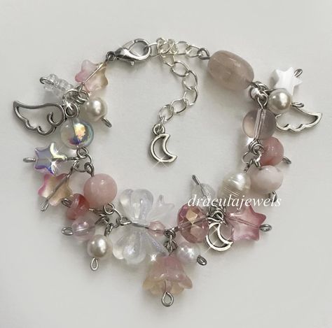 Fairy Bracelet Aesthetic, Cluttered Bracelets, Clutter Bracelet, Charm Bracelet Ideas, Charm Bracelet Diy, Fairy Bracelets, Pink Beaded Bracelet, Girly Bracelets, Handmade Charm Bracelets