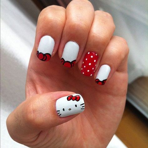 Peek a boo, I see a red ribbon, who is it? It’s Hello Kitty! A very cute and candid nail art design incorporating red and white shades. A red nail is further highlighted with adorable dots of white. Hello Kitty Nail Art, Kitty Nail Art, Paznokcie Hello Kitty, Hello Kitty Nail, Hello Kitty Nails Art, Kitty Nail, Kitty Nails, October Nails, Hello Kitty Nails