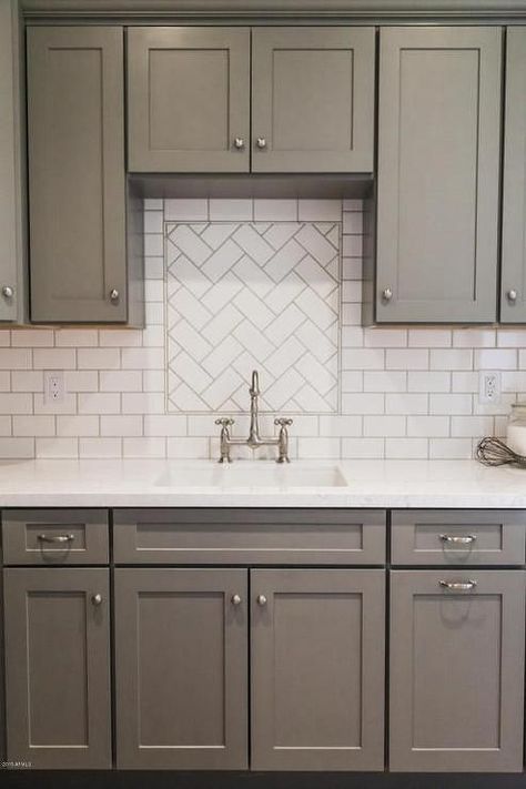 Top Hardware Styles To Pair With Your Shaker Cabinets | There’s nothing wrong with keeping it conventional. White Subway Tile Herringbone, Gray Shaker Kitchen Cabinets, Gray Shaker Cabinets, White Subway Tile Backsplash, Kabinet Dapur, Shaker Kitchen Cabinets, Herringbone Backsplash, Gray Cabinets, Classic Kitchen