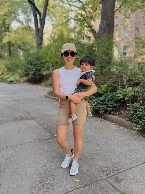 This workout outfit is made up of Amazon finds! Wearing a beige baseball cap, white tank with built-in bra, high waisted beige biker shorts and white Nike AirMax sneakers. Neutral Athleisure, Beige Baseball Cap, Bike Shorts Outfit, Athleisure Outfit, Beige Shorts, Cap White, White Sports Bra, Shorts Outfit, New Balance Sneakers