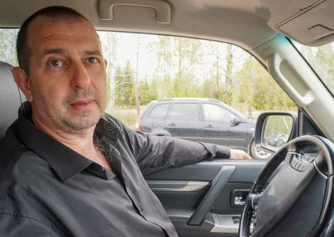 Man 50 years old in a black shirt driving a car stock photography New Years Eve Tops, Car Advertisement, 50 Year Old Men, Road Travel, Car Stock, Inside Car, Black Confetti, Holiday Design Card, Man Sitting