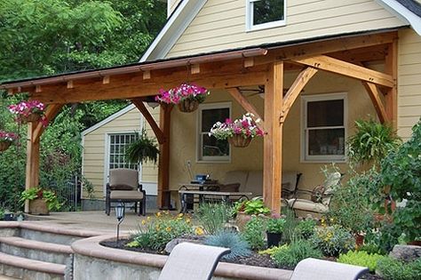 A traditional timber frame porch is topped with a balcony complete with custom timber railing in Pittsford NY. Description from pinterest.com. I searched for this on bing.com/images Deck Roof, Outdoor Covered Patio, Building A Porch, Pergola Ideas, Porch Roof, Retractable Canopy, Patio Cover, Backyard Porch, Patio Roof