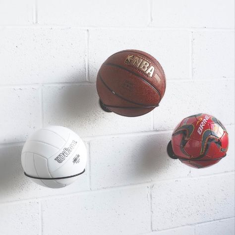 In Black, White. Our wall mountable ball rack display is the perfect accessory to organize athletic equipment for boys and girls. Arrange a child’s wall for a cute, practical basketball decor or mount in the garage for easy kid access. Install in the living room or office to display a special trophy ball or autographed souvenirs. Basketball Holder, Kids Room Bookshelves, Basketball Room, Basketball Decorations, Memorabilia Display, Ball Holder, Ball Storage, Wall Balls, Wall Bookshelves