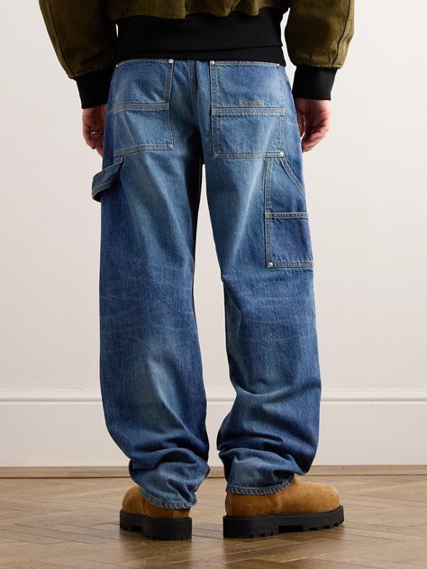 Givenchy's 'Carpenter' jeans are a nod to traditional workwear. Crafted in Italy from panels of rigid denim, they're detailed with a hammer loop and the brand's embroidered logo at the back pocket. Carpenter Outfits Men, Carpenter Jeans Outfit Men, Wardrobe Overhaul, Jean Pocket Designs, Jeans Outfit Men, Thrift Inspo, Workwear Brands, Blue Jeans Mens, Straight Leg Jeans Men