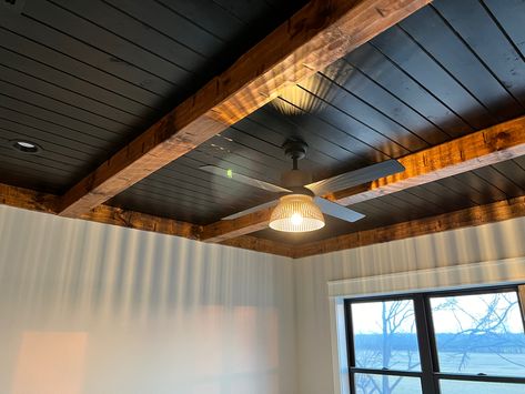 Wood And Black Ceiling, Sunroom Black Ceiling, Knotty Pine Ceiling With Beams, Black Sealing Interior, Black And Wood Ceiling, Black Ceiling With Beams, Black Tongue And Groove Ceiling, Black Wooden Ceiling, Black Ceiling With Wood Beams