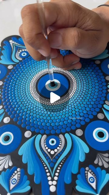 Vaishnavi | Mandala Artist on Instagram: "Embracing the power of the evil eye dot mandala. 🧿  This intricate design not only captivates with its beauty but also serves as a symbol of protection and good fortune. ✨  Each dot, each line, holds a deeper meaning, creating a shield against negativity. 🌟🧿   #mandalabyvaishnavi #mandala #dotmandala #evileyedotmandala #EvilEye #MandalaArt #evileyemandala #evileyeart #evileyemandalaart #trending #reelsinstagram #reels #trendingreels" Hamsa Art, Evil Eye Art, Symbol Of Protection, Rhinestone Projects, Evil Eye Design, The Evil Eye, Deeper Meaning, Dot Mandala, God Art