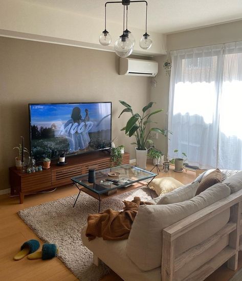 Apartment Living Room Beige, Simple Apartment Aesthetic, Living Room With Desk, Simple Cozy Living Room, Contemporary Apartment Living Room, Apartment Neutral, Tv Apartment, Glass Coffee Table Living Room, Cream Shag Rug