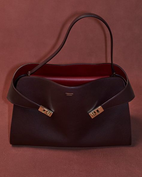 The Ferragamo Hug Bag Gets a Relaxed Update - PurseBlog Celebrity Bags, Everyday Luxuries, Fall 2023, Italian Leather, Contrasting Colors, Fashion News, Color Pop, Fashion Branding, Shoulder Strap