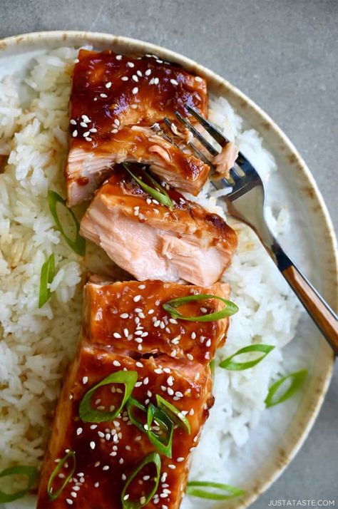 This Baked Salmon with Honey-Garlic Glaze has turned many a salmon-hater into a salmon-lover! It has the perfect balance of sweet and savory flavors thanks to an abundance of fresh garlic, ginger, honey, soy sauce and my not-so-secret ingredient, pineapple juice. Serve with your fave side and dinner is done! Honey Garlic Glazed Salmon, Simple Baked Salmon, Barramundi Recipes, Honey Soy Salmon, Asian Salmon Recipes, Baked Popcorn Chicken, Honey Glazed Salmon, Ginger Salmon, Salmon Glaze Recipes