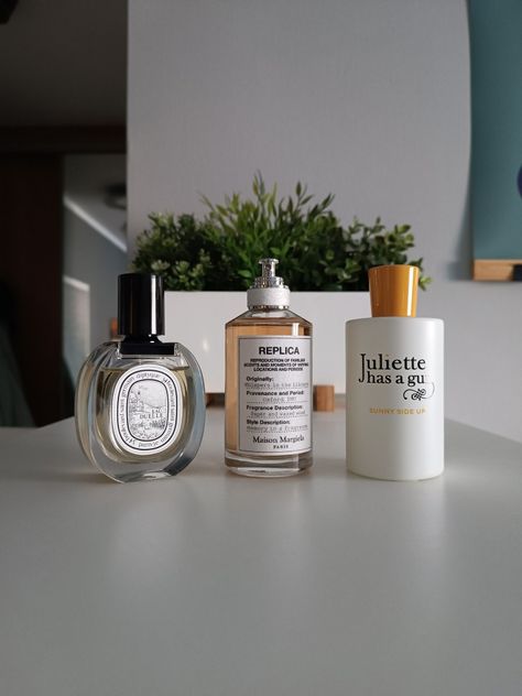 Photo of three perfume bottles standing on a shelf. Juliette Has Gan Not A Perfume, Whispers In The Library Perfume, Juliette Has Gan Parfum, Replica Whispers In The Library, Whispers In The Library, Niche Fragrances, Attar Collection, Margiela Replica, City Vibe