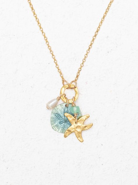 Explore the playful elegance of the Sandra Necklace, featuring charms of a pearl, starfish, and sand dollar on a slender chain. Perfect for layering or as a standalone piece. Evry Jewels, Beachy Necklace, Surf Jewelry, Beachy Jewelry, Jewelry Accessories Ideas, Dope Jewelry, Classy Jewelry, Jewelry Essentials, Stacked Jewelry