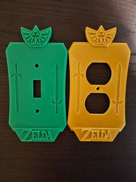 Put the final touches on your Legend of Zelda themed bedroom, bathroom, or theater room with these light switch / outlet covers.  This is a simple yet exciting addition to a home that will surely earn you compliments from any visiting guests. Designed and tested by an experienced CAD specialist.  These cover plates are 3D printed out of *PLA.  If you don't see the cover type you are in need of, or are looking for a different color, please send me a message and I will do my best to help you out. We also do custom cover plates, so if Legend of Zelda isn't really what you are looking for, we can help you there too! It can literally be any theme (Sports, nature, movies, video games, books, logos, holidays, etc.), if you can dream it, we can create it! *PLA is one of the most common materials u Legend Of Zelda Bedroom, Zelda Themed Room, Zelda Bedroom Ideas, Legend Of Zelda Room, Zelda Nursery, Zelda Bedroom, Zelda Room, Lilly Grace, Nerd Home