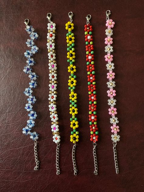 Colorful Seed Bead Bracelet Dainty Beaded Flowers Bracelets Tiny colorful seed beads make up this delicate flower bracelet. Great for layering with other bracelets Choose your length for the perfect fit. Includes a lobster clasp and 1.5 inch extension chain.  *Some colors may be fade over time after being exposed to water. Comes in various different sizes or just order your favorite color and size and we will make it especially for you. Add to that our asortments of beautiful array of colored beaded barefoot sandals excellent for the beach. Anklets, necklace, and bracelets, that skillfully made with love.  Buy as singles or as a set.  Used as a sentiment for your love ones, him and hers bracelets, personalized names, zodiac signs. Great for any gifts ideas. Islandgirls Summer Sassy jewelry Bracelets Ideas For Summer, Cute Tiny Bead Bracelet Ideas, Anklet Seed Bead, Beaded Bracelets Seed Beads, Seed Bead Creations, Seed Bead Bracelet Sets, Seed Bead Bracelets Flower, Simple Seed Bead Bracelets, Things To Make With Seed Beads