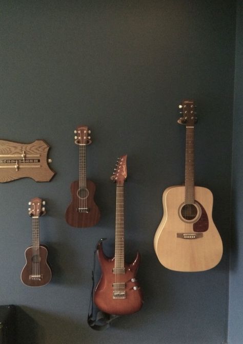 Instruments Hung On Wall, Guitars Hung On Wall, Ukulele Bedroom, Guitar Feature Wall, Guitars On Wall, Guitar Hanging Ideas, Guitars On The Wall, Hanging Guitars, Guitar Decorations