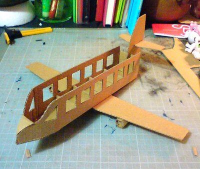 cardboard plane, mini version but use same layout and concept for 5 rows of two Cardboard Airplane Diy, Airplane Pinata, Plane Room Decor, Cardboard Plane, Barbie Plane, Airplane Party Theme, Cardboard Airplane, Make A Plane, Floral Christmas Tree